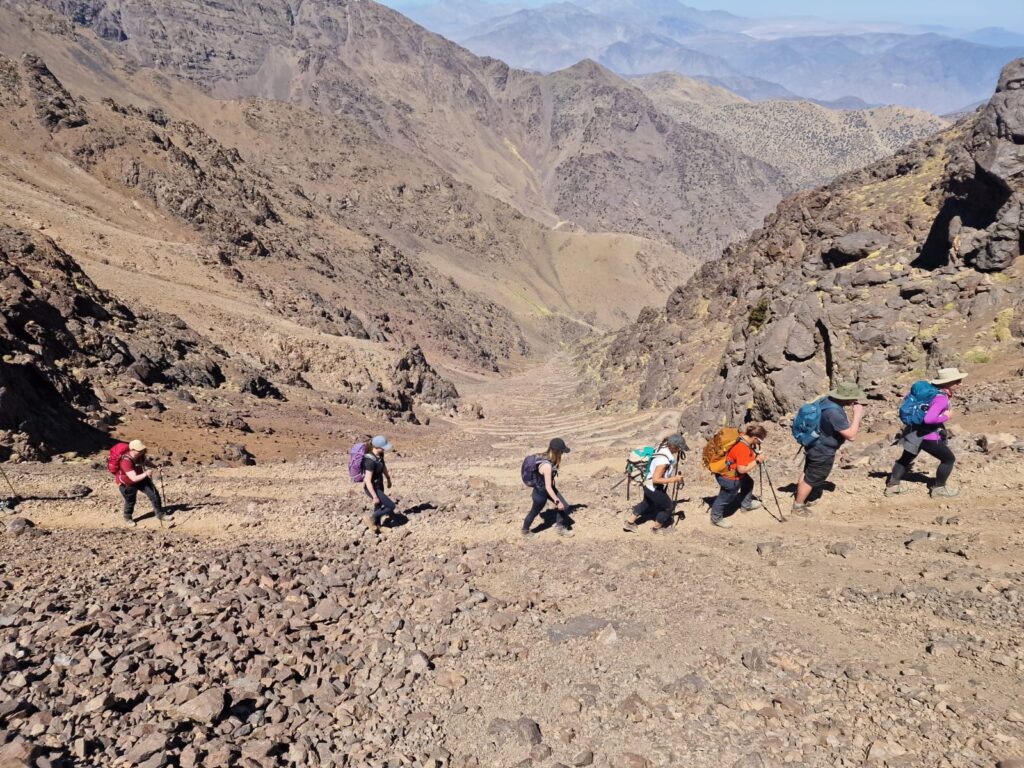 trekkers in atlas mountains